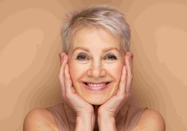 Elderly woman smiling with radiant skin.