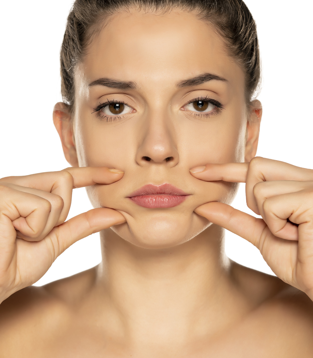 Serious faced woman pinching her mouth area between her thumb and index fingers on either side of her face.